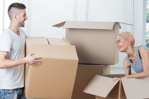 Packing boxes and furniture for a Waterloo removal van