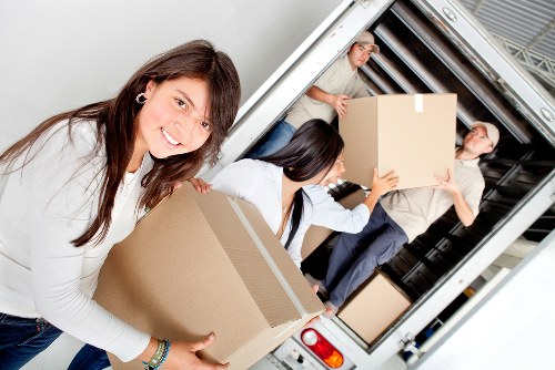 Packed boxes and furniture ready for urgent removal service