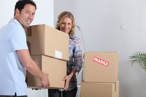 Moving team handling bulky furniture in Waterloo apartment