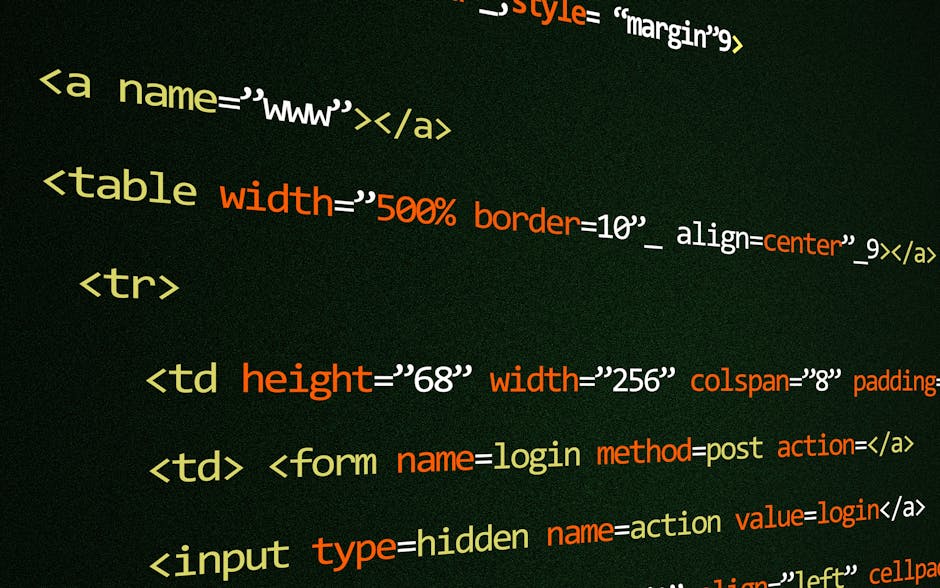 Close-up of a person's right hand operating a silver laptop on a wooden desk with visible code on the screen. The individual is wearing a black wristwatch and appears to be engaged in tasks that may i